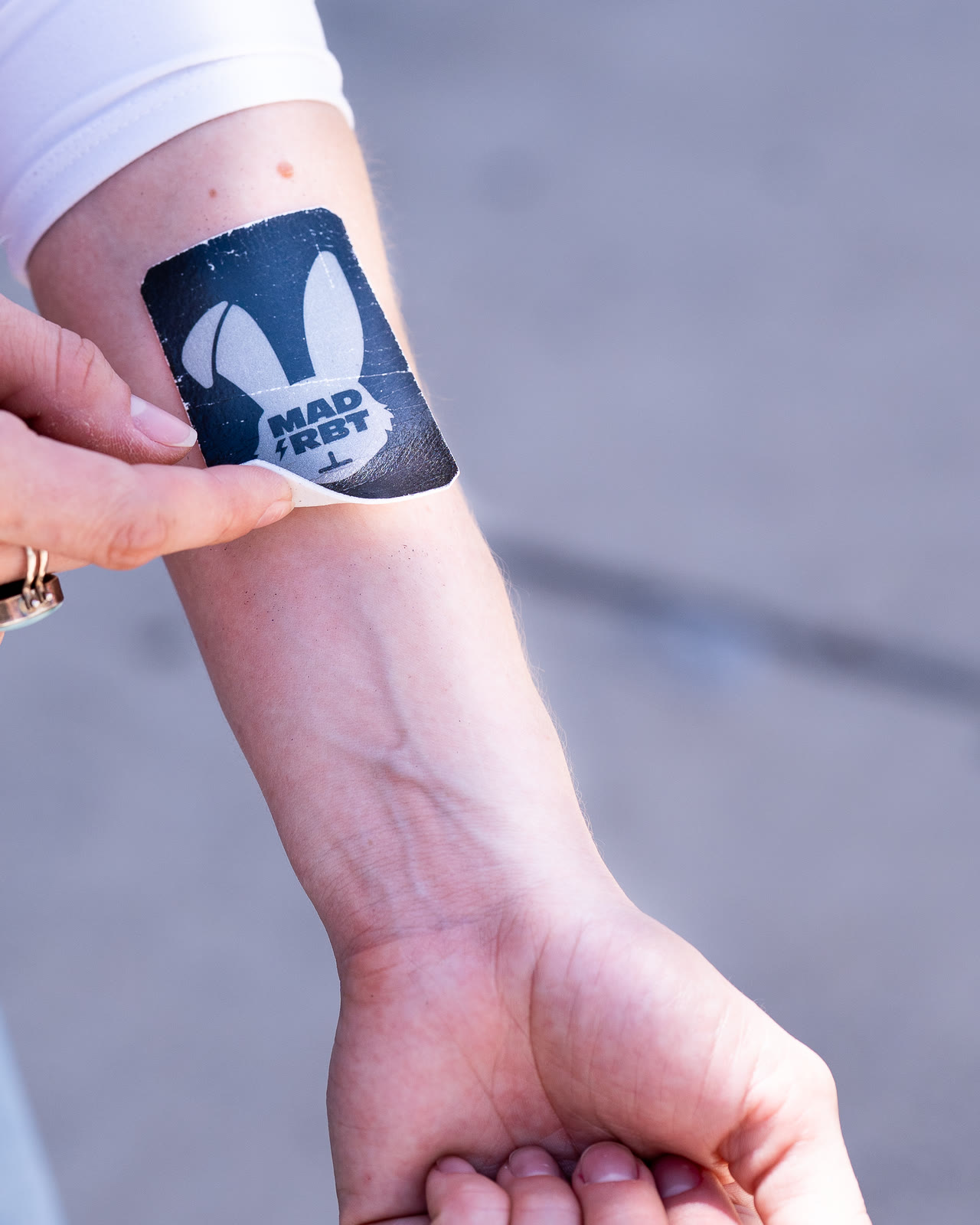 Mad Rbt energy patch being applied to a forearm